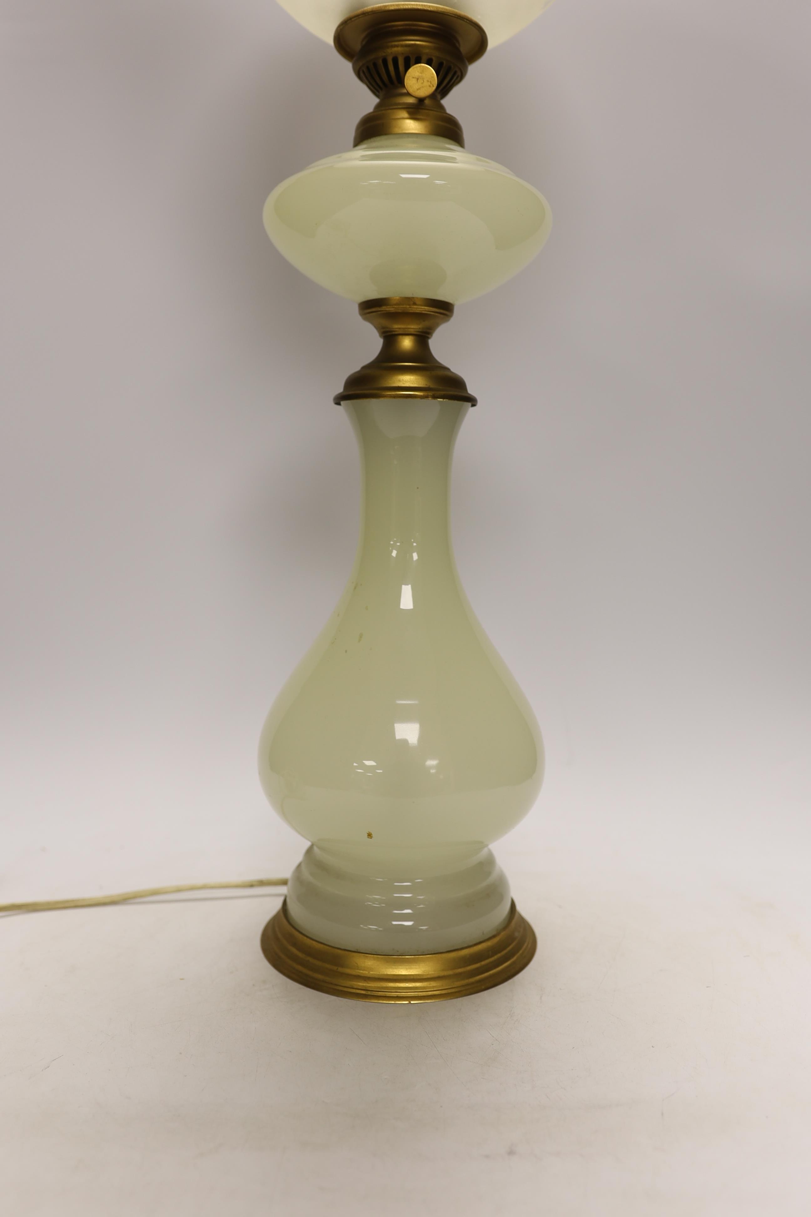 An opaque glass oil converted to a table lamp, 66cm high